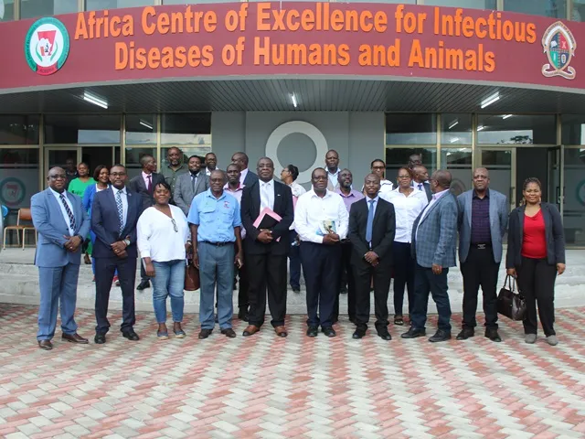 A photo of the ACEIDHA team in front of the new building