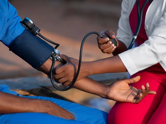 A photo of a nursing checking blood pressure